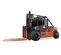 Side view of an orange and black Toyota warehouse forklift with a black mast and orange forks with an enclosed cabin.