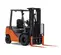 Front angled view of orange and black warehouse forklift with black lifting mast and orange forks with an open cabin.