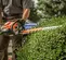 Taille-haie Stihl orange avec lame de 76 cm