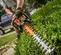 Taille-haie Stihl orange avec lame de 76 cm