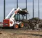 Chargeuse à direction à glissement BOBCAT blanche, noire et orange 770 à 860 kg