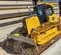 Bouteur John Deere jaune avec faible pression au sol 
