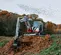 Red and white Takeuchi Mini Excavator with Reduced Tail Swing