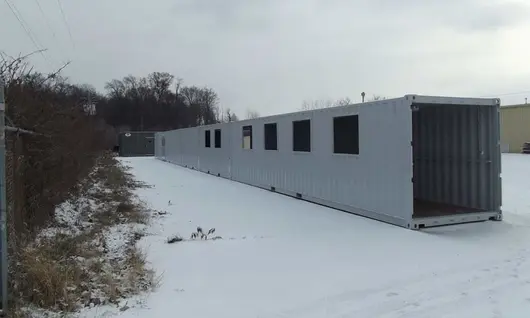 Container covered walkway in snow