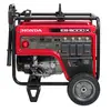 Génératrice portative de 5 000 à 5 400 W HONDA rouge et noire, essence