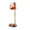 Side angled view of an extended orange and beige vertical mast lift with basket.