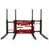 Front view of a red double forklift attachment with two sets of black forks extended.