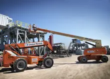 jobsite with boom lifts and forklifts 